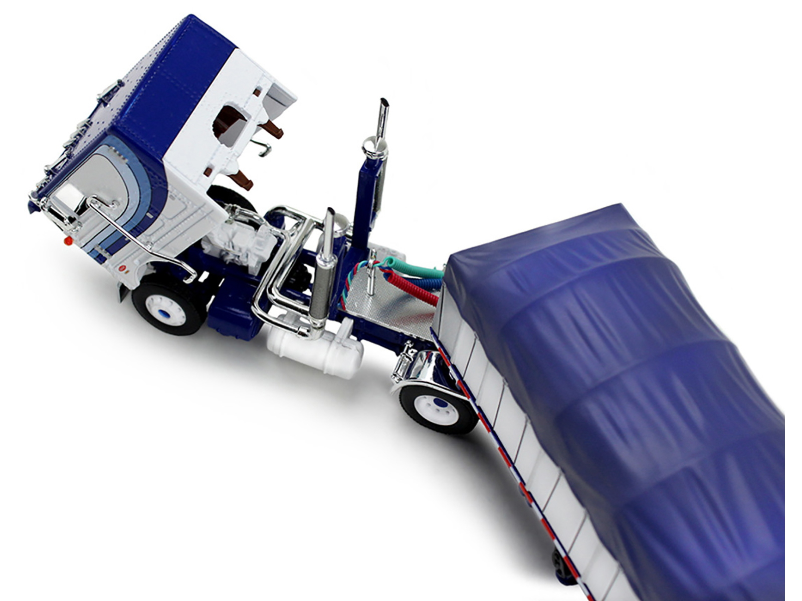 Peterbilt 352 COE 110" Sleeper and 53’ Wilson Roadbrute Flatbed Trailer with Covered Wagon White with Blue Stripes 1/64 Diecast Model by DCP/First Gear - Image 2